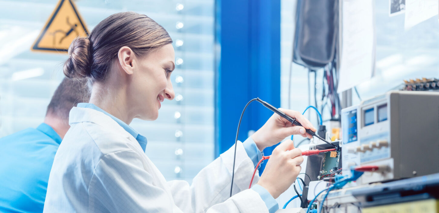 team-of-engineers-testing-and-measuring-an-electronic-product-in-the-lab
